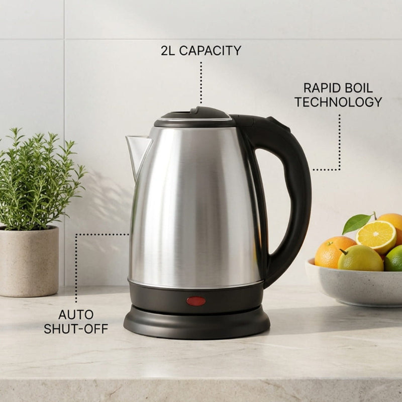 A stainless steel electric kettle with a black handle and base sits on a light countertop in a kitchen setting, with text callouts highlighting features like 2L capacity, rapid boil technology, auto shut-off, premium stainless steel, 360° swivel base, and energy efficient design.