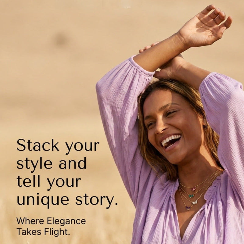 A woman in a light lavender long-sleeve blouse stands in a field of dry golden grass, smiling with her arms raised. Text on the left reads, 'Stack your style and tell your unique story.