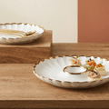 Gold plated round tray by NOVA with a polished finish, perfect for serving or decorative display.