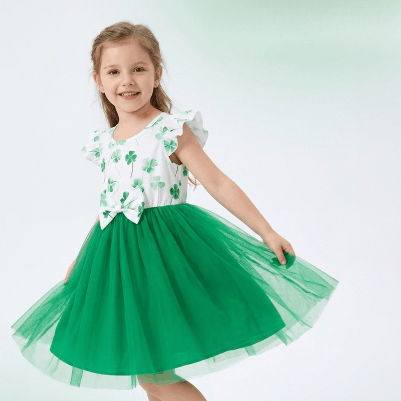 NOVA girls' summer dress for ages 4-7, featuring a colorful, sleeveless design with floral patterns and lightweight fabric.
