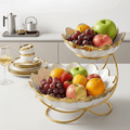 Elegant gold ceramic fruit bowl dinner set by NOVA, featuring stylish bowls for serving fruit or desserts.