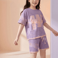 Girls sports casual look set by NOVA for ages 7-11, featuring a trendy summer outfit with a T-shirt and shorts.