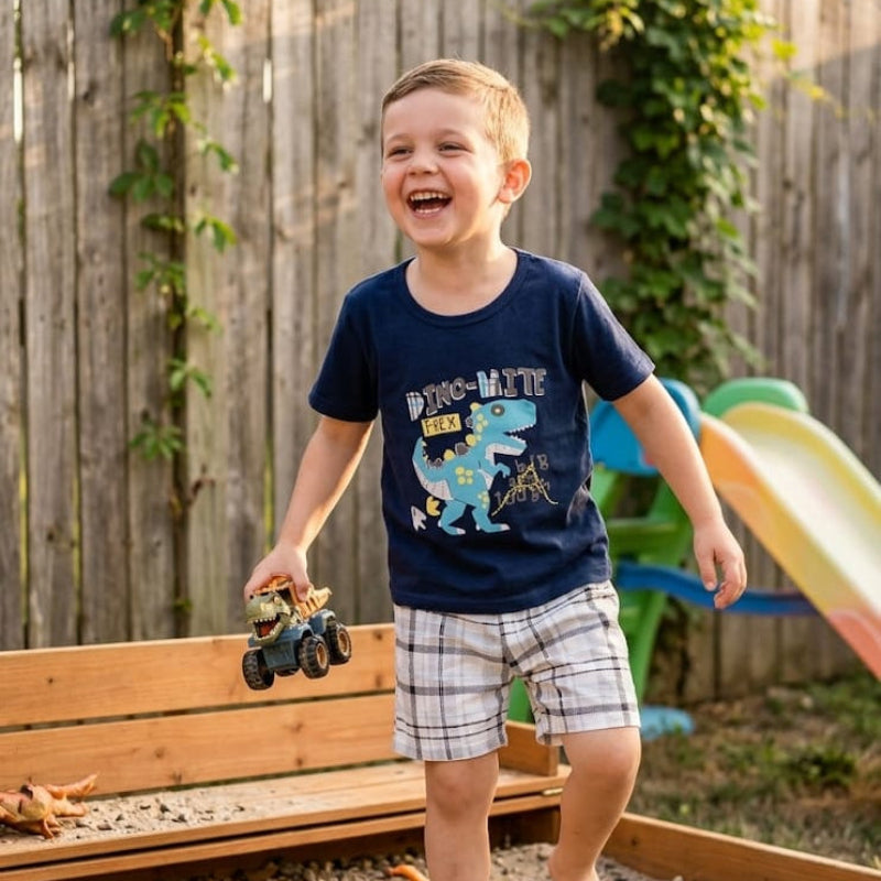 Navy dinosaur cartoon set for boys by NOVA, featuring playful dinosaur illustrations on fabric.