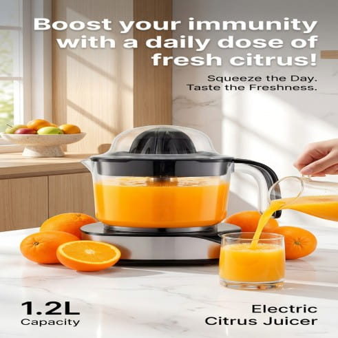 Electric citrus juicer with oranges and a glass of juice on a kitchen counter.