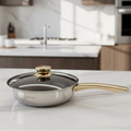 Stainless steel frying pan with 25 cm diameter and gold glass lid, brand NOVA, suitable for stovetop cooking and easy viewing.